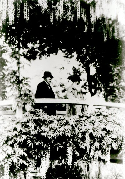 Georges Clemenceau, Claude Monet, and Alice Butler on the Japanese Bridge in Monet